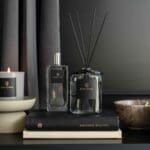 100ml-fragranced-diffuser-ash-collection-product-image-with-grey-liquid-and-black-reeds