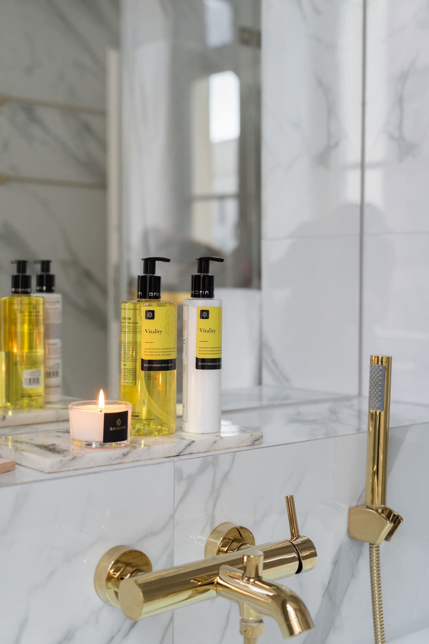 500ml-moisturising-hand-wash-vitality-with-hand-moistureser-and-candle-in-bathroom