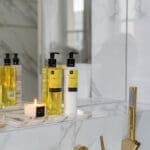 500ml-moisturising-hand-wash-vitality-with-hand-moistureser-and-candle-in-bathroom