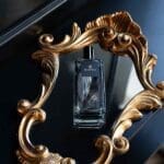 Obsidian-collection-100ml-room-spray-black-liquid-on-a-shiny-black-surface-in-a-frame