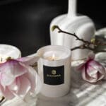 uxury-scented-candle-pearl-collection-lit-up-angle-white-vesse-white-wax-scented
