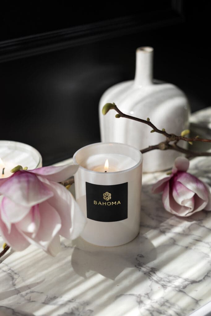 uxury-scented-candle-pearl-collection-lit-up-angle-white-vesse-white-wax-scented