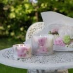 garden-rose-grand-pillar-candle-outdoor-nature-on-table-lit-up