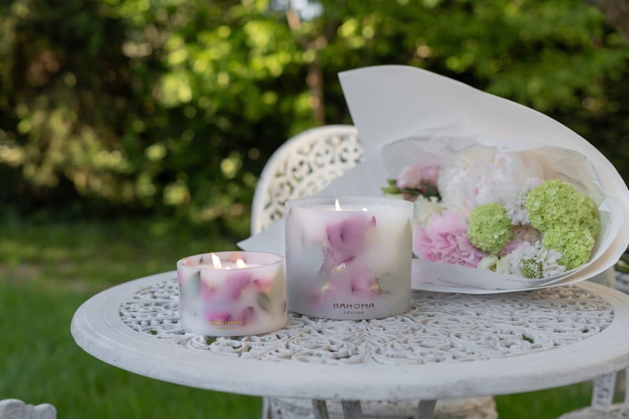 garden-rose-grand-pillar-candle-outdoor-nature-on-table-lit-up