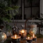 Black wax Silent Night nine lights mixed mini candles on a table