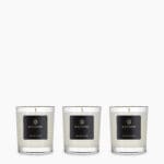 Set of 3 Orange Spice scented travel candles by Bahoma in clear glass jars with black labels