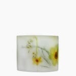 Left profile of the Awakening Scented Grand Pillar Candle showing its impressive scale and white wax.