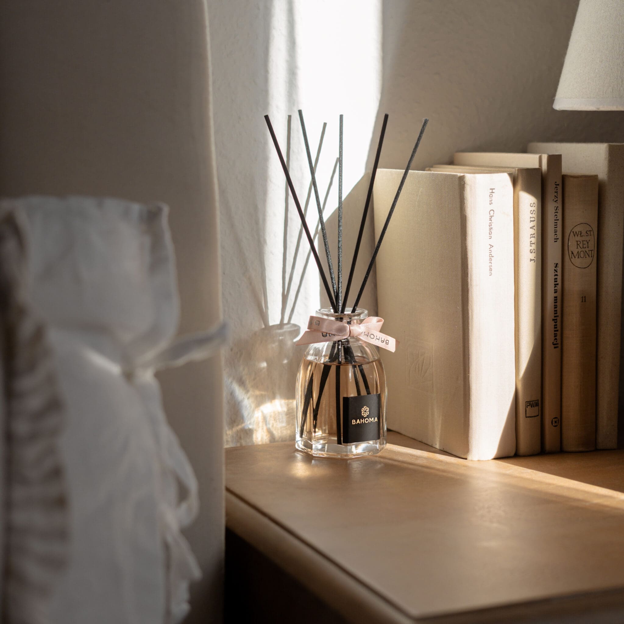 Set-2-x-100ml-Octagonal-Diffuser-in-a-gift-box-on-a-side-table