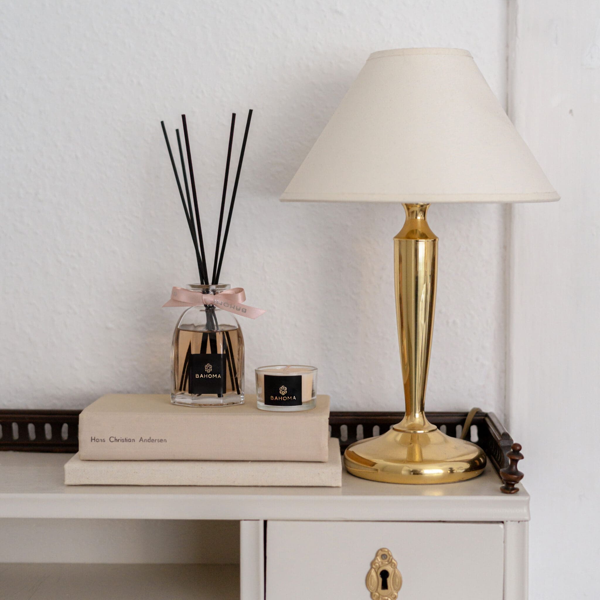 Set-2-x-100ml-Octagonal-Diffuser-in-a-gift-box-with-mini-candle-on-a-book-