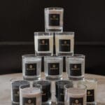 Set 3 x Scented Travel Candle in a box in a lifestyle arrangement of other fragrances and colours available in this product category