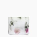 Left profile of Sakura Avenue Scented Grand Pillar Candle showing large scale and petals.